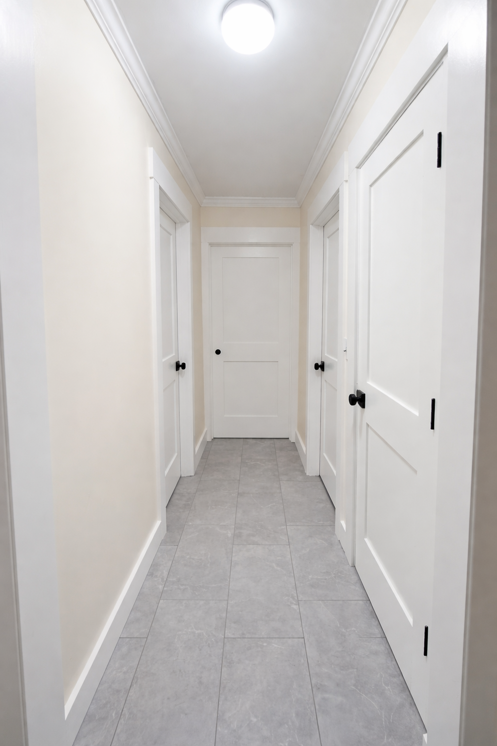 Hallway with white trim and doors